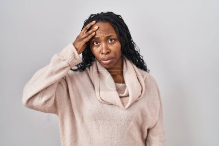 Photo for African woman standing over white background worried and stressed about a problem with hand on forehead, nervous and anxious for crisis - Royalty Free Image