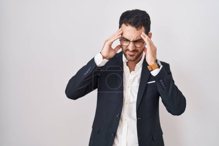 Photo for Handsome business hispanic man standing over white background with hand on head, headache because stress. suffering migraine. - Royalty Free Image