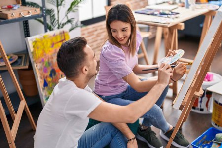 Photo for Man and woman artists couple smiling confident drawing at art studio - Royalty Free Image