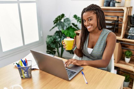 Photo for Young african american woman business worker using laptop working at office - Royalty Free Image