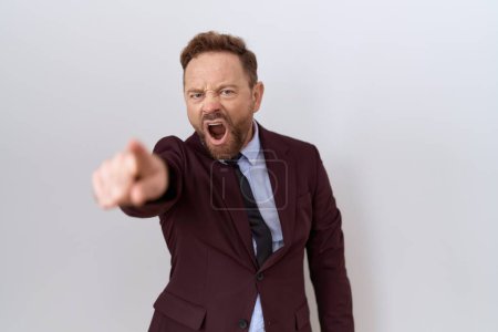 Photo for Middle age business man with beard wearing suit and tie pointing displeased and frustrated to the camera, angry and furious with you - Royalty Free Image