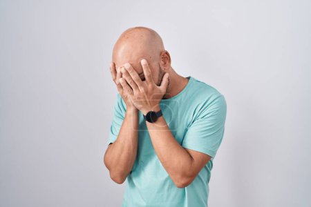 Photo for Middle age bald man standing over white background with sad expression covering face with hands while crying. depression concept. - Royalty Free Image