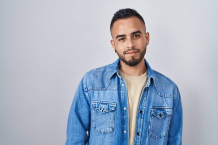 Photo for Young hispanic man standing over isolated background looking sleepy and tired, exhausted for fatigue and hangover, lazy eyes in the morning. - Royalty Free Image