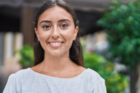 Photo for Young beautiful hispanic woman smiling confident standing at street - Royalty Free Image
