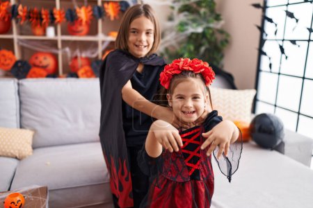 Photo for Adorable boy and girl having halloween party walking at home - Royalty Free Image