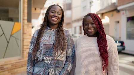 Téléchargez les photos : Two african american friends smiling confident standing together at street - en image libre de droit