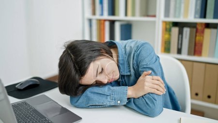 Photo for Young caucasian woman student sleeping at university classroom - Royalty Free Image