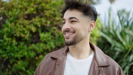Photo for Young arab man smiling confident standing at park - Royalty Free Image