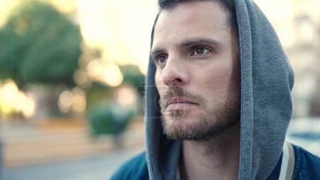 Photo for Young caucasian man standing wearing hoodie with serious expression at street - Royalty Free Image