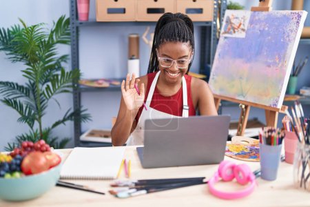 Photo for African american woman artist having online draw lesson at art studio - Royalty Free Image
