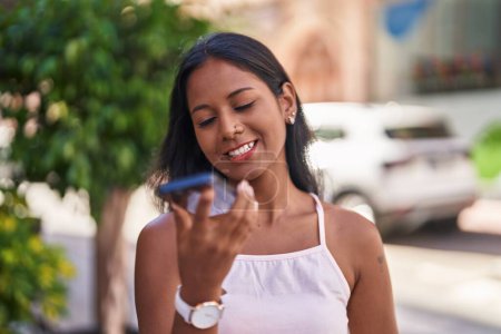 Photo for Young beautiful woman smiling confident talking on the smartphone at street - Royalty Free Image