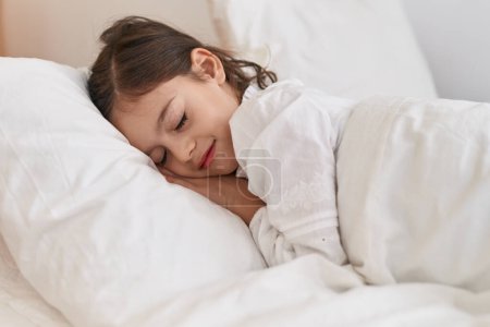 Photo for Adorable hispanic girl lying on bed sleeping at bedroom - Royalty Free Image