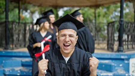 Photo for Group of people students graduated holding diploma with winner expression at university campus - Royalty Free Image