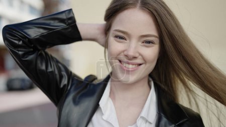 Photo for Young blonde woman smiling confident standing at street - Royalty Free Image