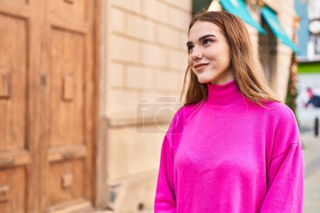 Photo for Young woman smiling confident looking to the side at street - Royalty Free Image