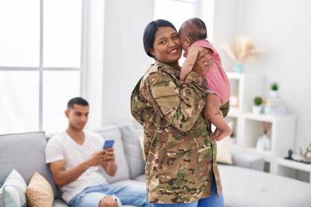 Photo for Hispanic family army soldier hugging each other at home - Royalty Free Image