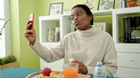 Photo for African american woman taking selfie picture having breakfast at dinning room - Royalty Free Image