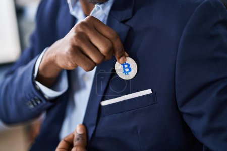 Photo for African american man business worker holding bitcoin at office - Royalty Free Image