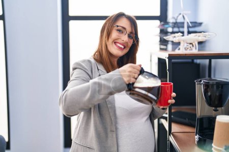 Photo for Young pregnant woman business worker drinking coffee at office - Royalty Free Image