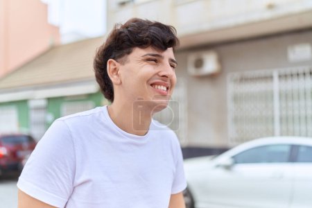 Photo for Non binary man smiling confident looking to the side at street - Royalty Free Image