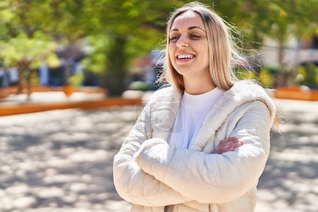 Photo for Young woman smiling confident standing with arms crossed gesture at park - Royalty Free Image