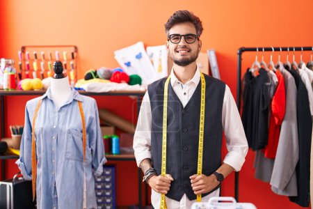Photo for Young hispanic man tailor smiling confident standing at atelier - Royalty Free Image