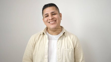 Foto de Young hispanic man smiling confident standing over isolated white background - Imagen libre de derechos