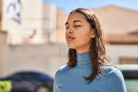 Photo for Young african american woman breathing at street - Royalty Free Image