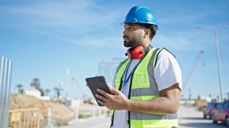 Photo for African american man builder using touchpad at street - Royalty Free Image