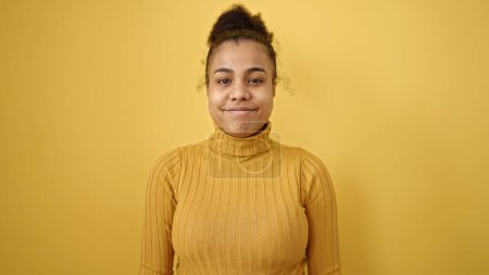 Photo for Young african american woman smiling confident over isolated yellow background - Royalty Free Image