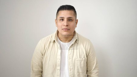 Foto de Young hispanic man standing with relaxed expression over isolated white background - Imagen libre de derechos