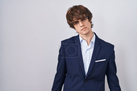 Photo for Hispanic business young man wearing glasses looking sleepy and tired, exhausted for fatigue and hangover, lazy eyes in the morning. - Royalty Free Image