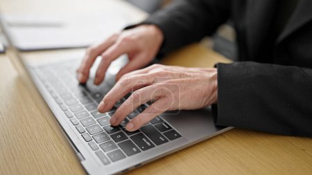 Photo for Mature hispanic woman using computer typing on keyboard at office - Royalty Free Image