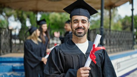 Photo for Group of people students graduated holding diploma at university campus - Royalty Free Image