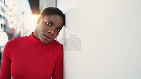 Photo for African american woman standing with serious expression at street - Royalty Free Image