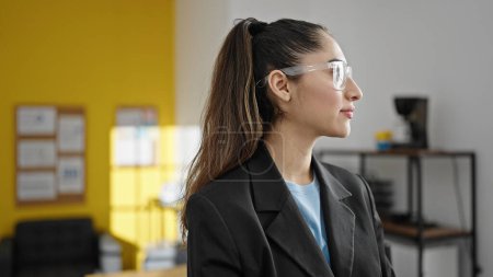 Photo for Young beautiful hispanic woman business worker standing with serious expression at office - Royalty Free Image
