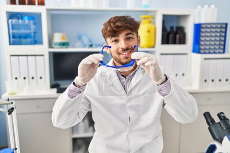 Photo for Young arab man scientist holding security glasses at laboratory - Royalty Free Image