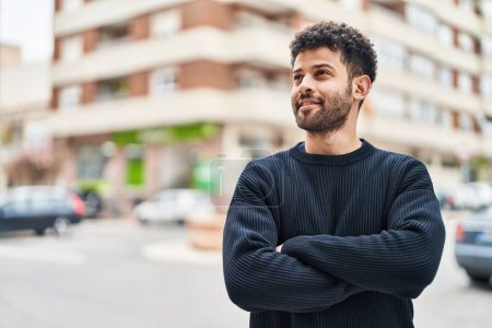 Photo for Young arab man smiling confident standing with arms crossed gesture at street - Royalty Free Image