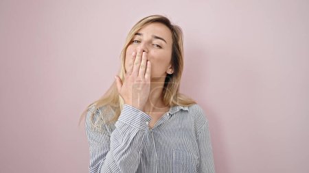 Photo for Young blonde woman smiling confident blowing kiss over isolated pink background - Royalty Free Image