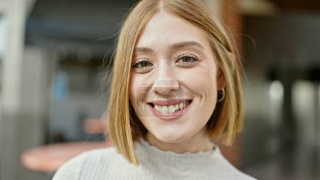 Photo for Young blonde woman smiling confident standing at coffee shop terrace - Royalty Free Image