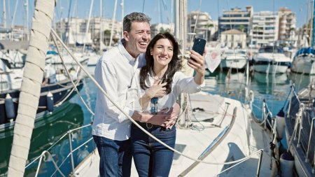 Photo for Senior man and woman couple smiling confident make selfie by camera at boat - Royalty Free Image