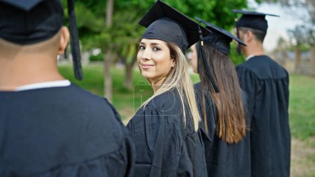 Photo for Group of people students graduated smiling confident standing together at university campus - Royalty Free Image