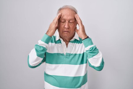 Photo for Senior man with grey hair standing over white background with hand on head, headache because stress. suffering migraine. - Royalty Free Image
