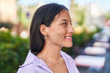 Photo for Young beautiful hispanic woman smiling confident looking to the side at street - Royalty Free Image