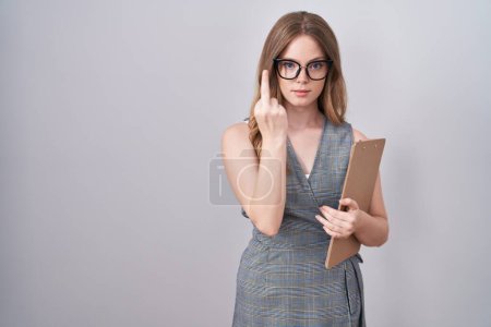 Foto de Caucasian woman wearing glasses and business clothes showing middle finger, impolite and rude fuck off expression - Imagen libre de derechos