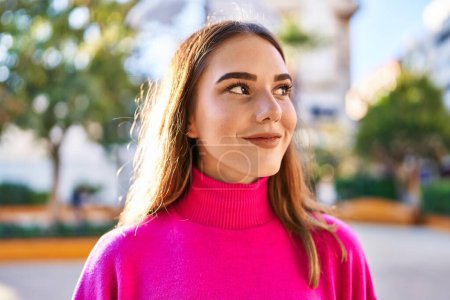 Photo for Young woman smiling confident looking to the side at park - Royalty Free Image