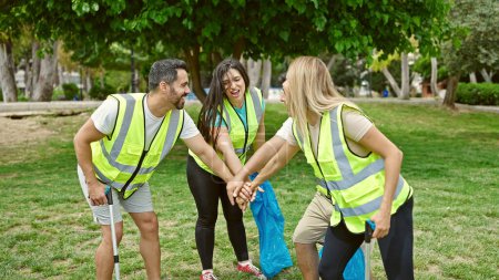 Photo for Group of people volunteers with hands together at park - Royalty Free Image