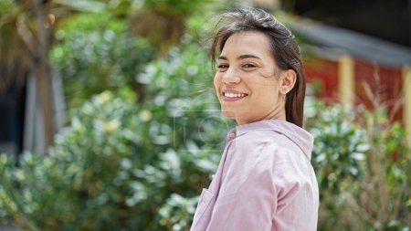 Photo for Young beautiful hispanic woman smiling confident standing at park - Royalty Free Image