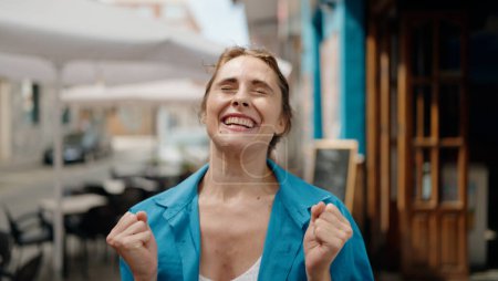 Photo for Young woman smiling confident surprised at street - Royalty Free Image