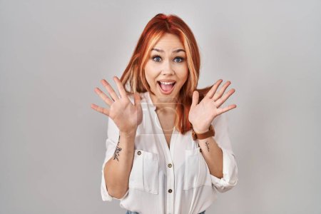 Photo for Young caucasian woman standing over isolated background celebrating crazy and amazed for success with arms raised and open eyes screaming excited. winner concept - Royalty Free Image